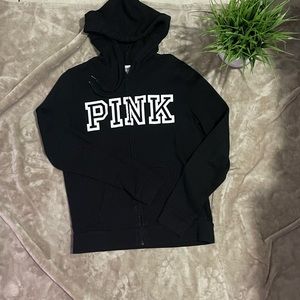 Pink logo, zip up sweater.
